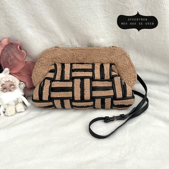 Themoiré handbag collection displayed on a minimalist shelf